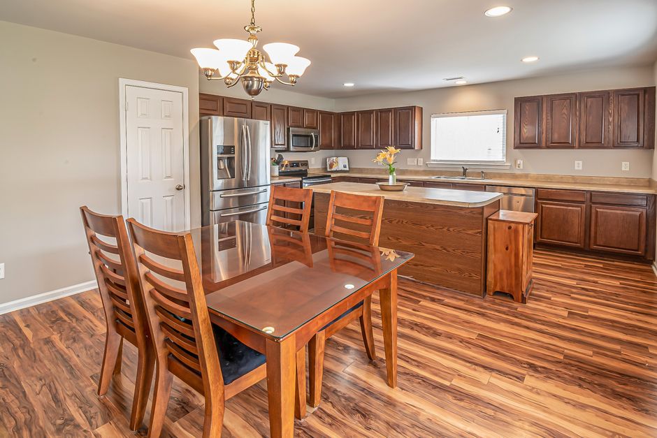 Painted cabinetry and a countertop in a finished room